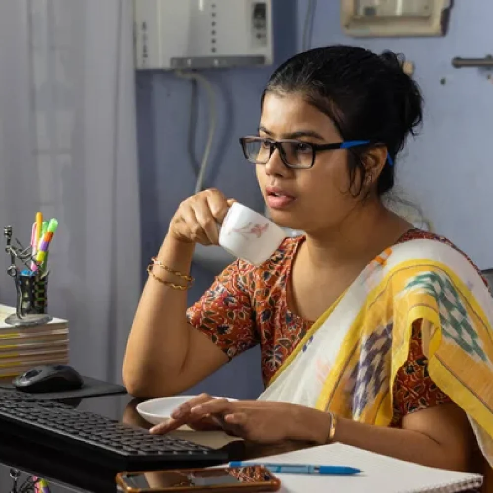 depositphotos_543979672-stock-photo-indian-woman-saree-working-computer